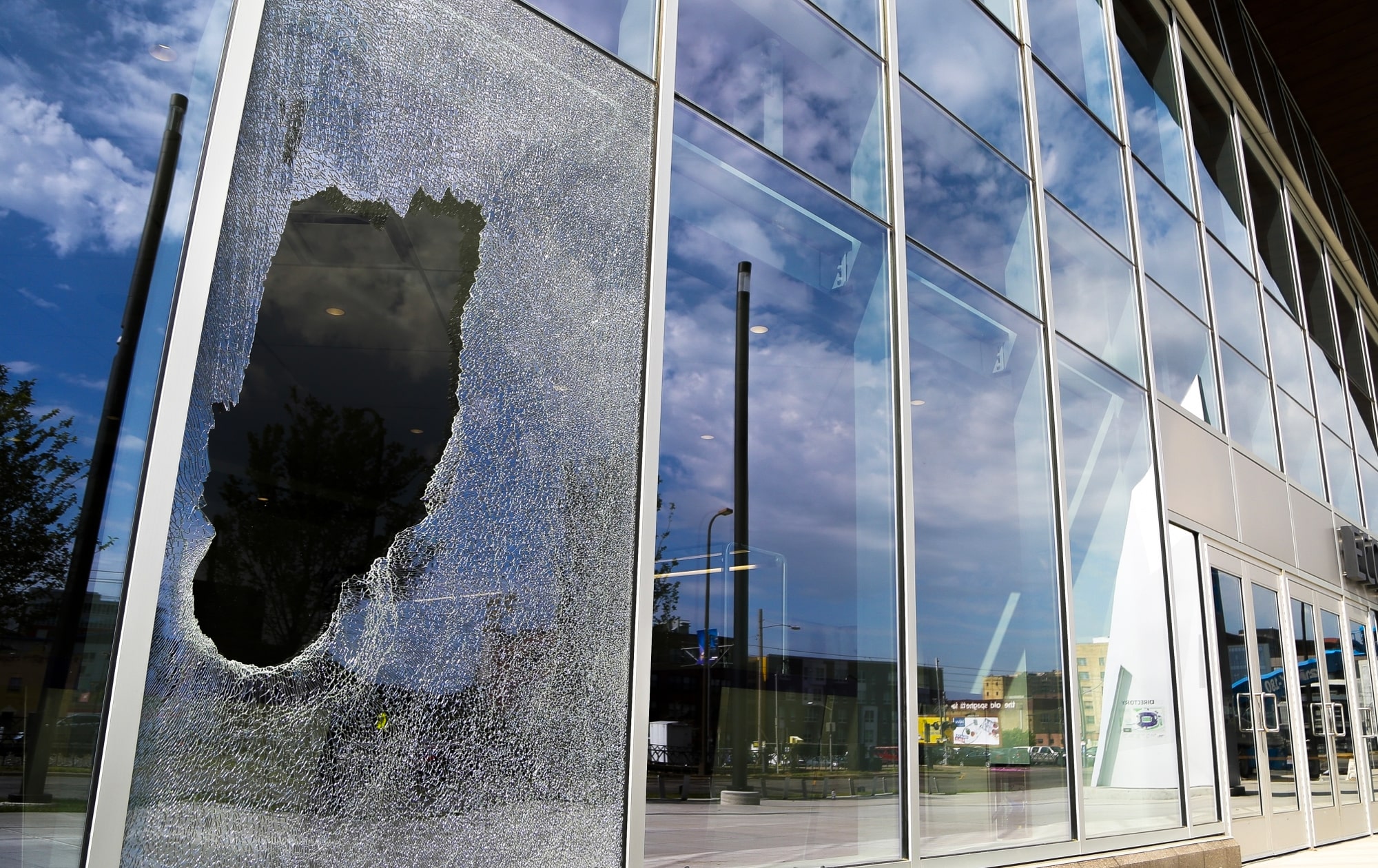 A large array of windows with one panel broken into.