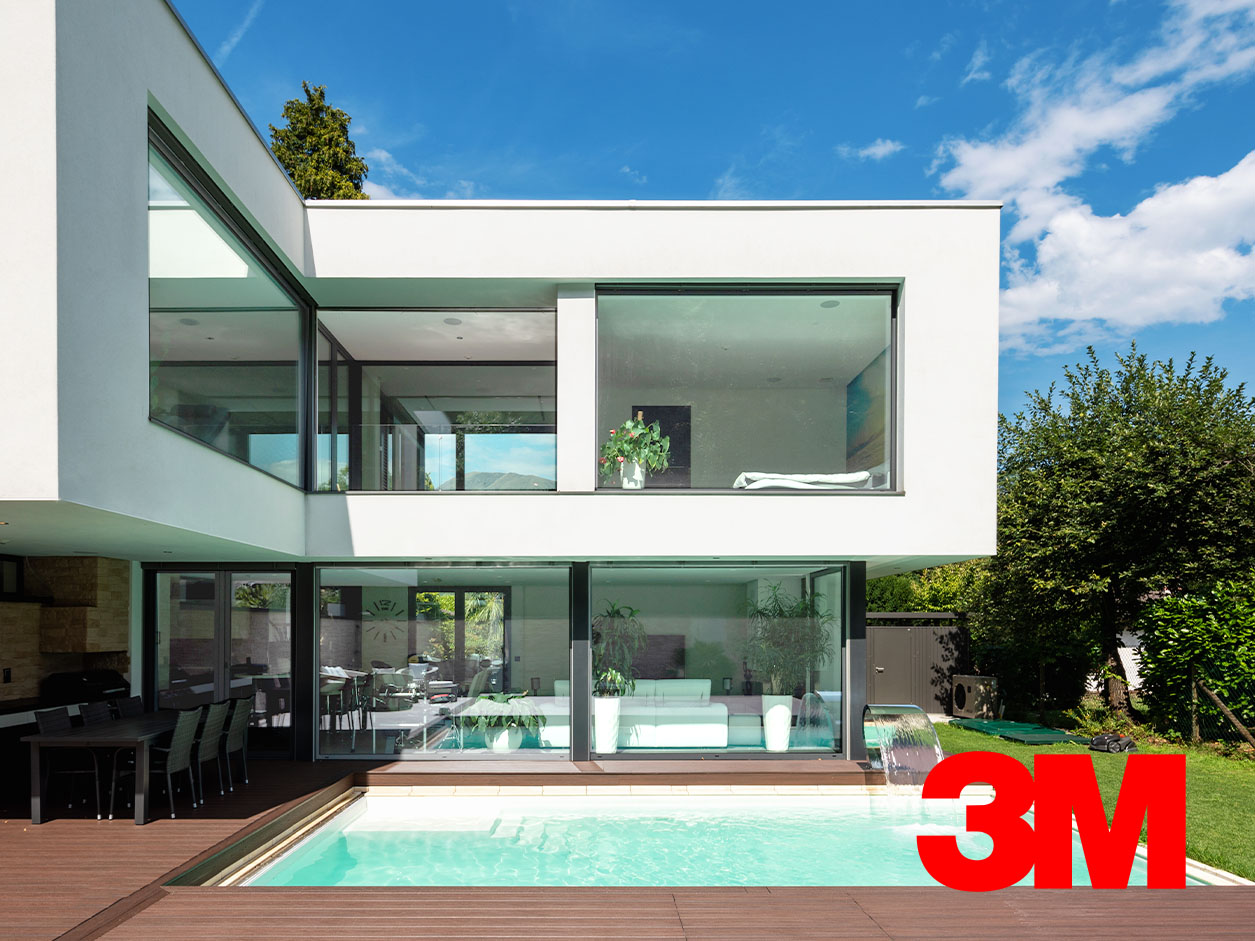 A modern, white condo with a pool.